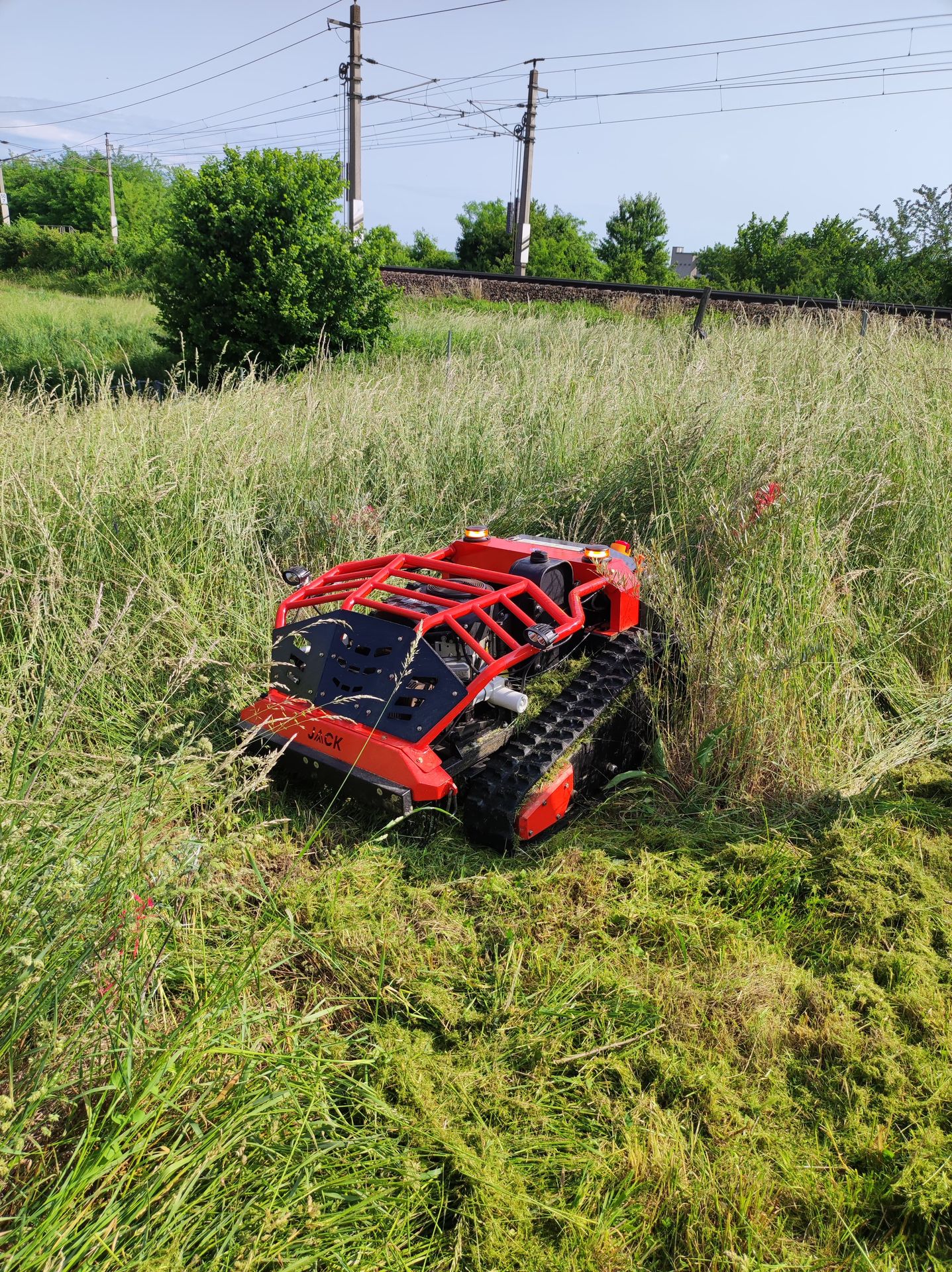 Jack Mulcher crawler mower during slope maintenance