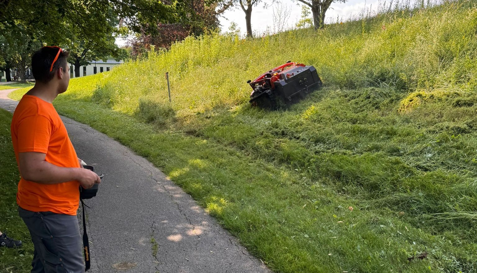 Jack mowing robot during slope maintenance summer mowing deployment